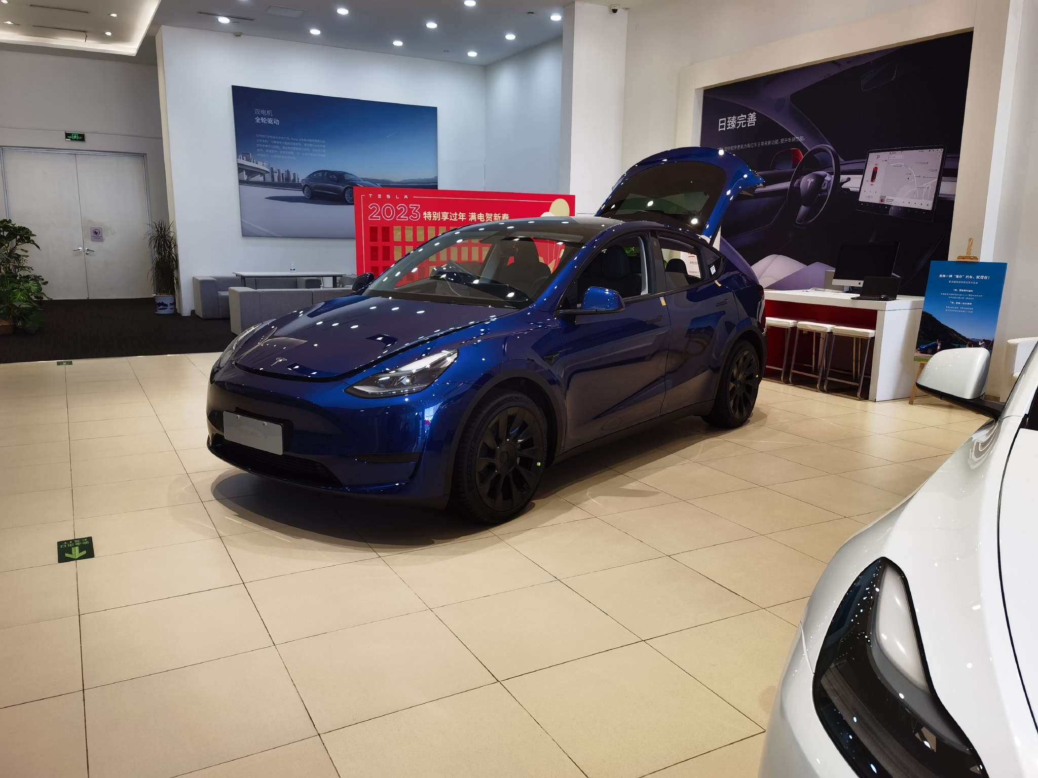 新春走基层丨新能源汽车大幅降价引发购车热潮?北京、上海略显冷淡,不少订单节前已释放